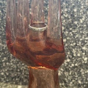 Ring not real diamond band missing a stone please see photos size 6.5